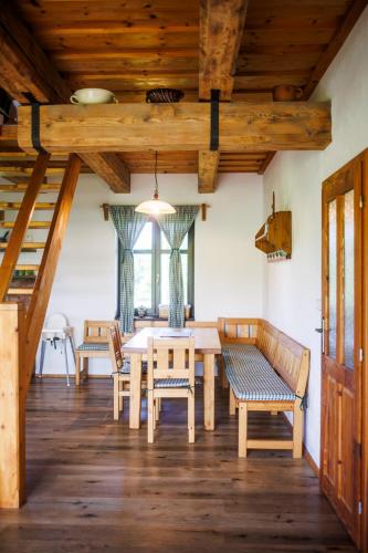a dining room with a table and chairs at Wellness chalupa Šindelka in Králíky