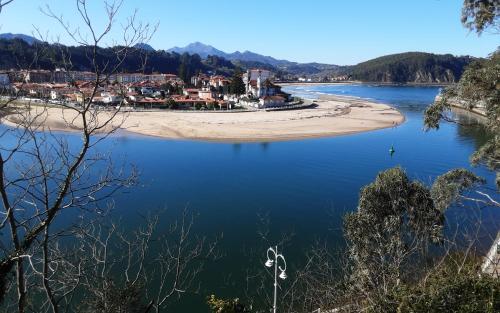 a view of a river with a town in the distance at Sellamante2 in Ribadesella