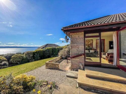 a home with a view of the ocean at Chanonry View Holiday Cottage in Fortrose
