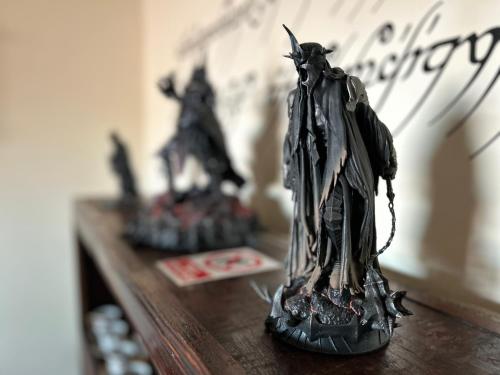 a figurine of a bat standing on a table at Casa Rivendel - Fantasía, Confort y Naturaleza in Poyales del Hoyo