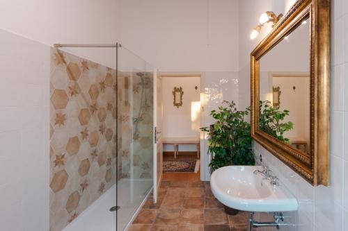a bathroom with a sink and a mirror at Villa Casale Chiesina in Bibbiena