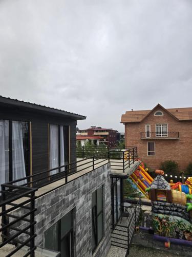 a balcony of a house with a bunch of slides at Blue Horizon Apartments in Ureki