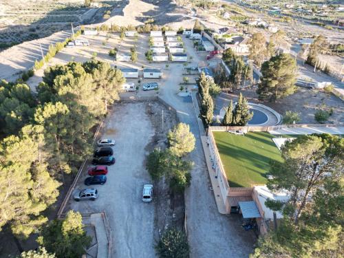 an aerial view of a parking lot with cars parked at Camping Albox in Albox