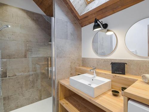 a bathroom with a sink and a shower at Maison rénovée familiale au village - FR-1-808-19 in Le Monêtier-les-Bains