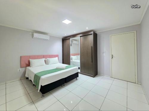 Postel nebo postele na pokoji v ubytování Casa quintal amplo 10 min Centro 2 quartos