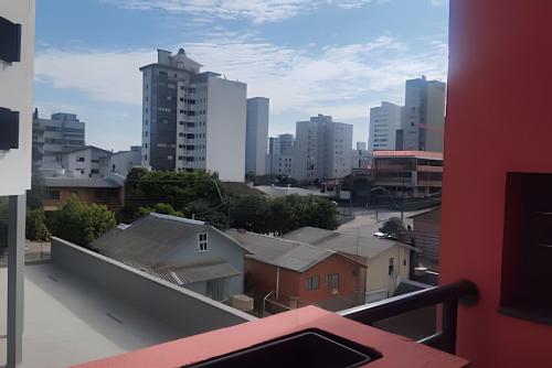 a view of a city from a balcony at Apartamento Central com suite Panazzolo 7 minutos do centro in Caxias do Sul