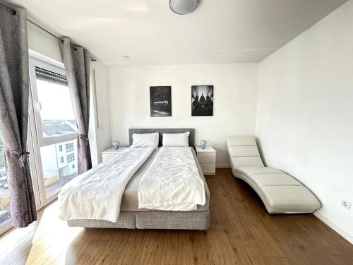 Giường trong phòng chung tại City Apartment mit Schlossblick