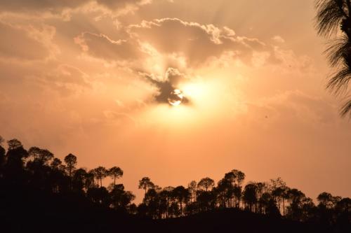 a heart shaped cloud in the sky at sunset at TreeHouse Kasauli Operated By Splendid Hotels I Vacations I Family Groups & Events I Forest Treks I Memories I in Kasauli