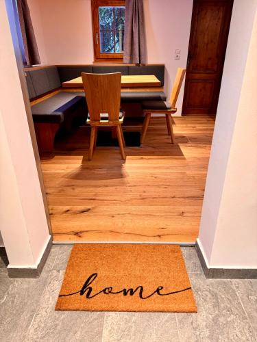 a welcome mat on the floor of a room with a piano at Das Alpl Resort in Krieglach