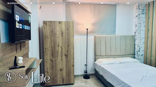 Ένα ή περισσότερα κρεβάτια σε δωμάτιο στο Suite Romance Valledupar