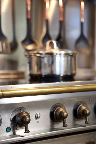 a metal pot sitting on top of a stove at Rafina Splendor in Rafina