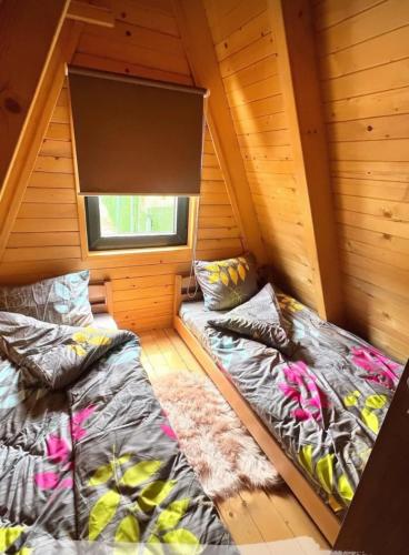 Postel nebo postele na pokoji v ubytování Villa Konezal