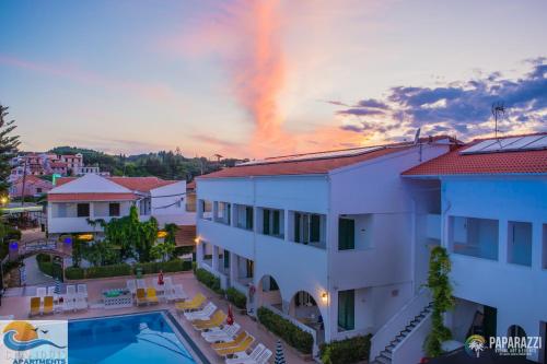 
a hotel room with a balcony overlooking the ocean at Chandris Apartments in Kavos

