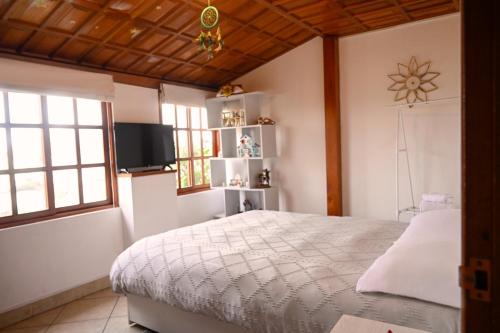 Giường trong phòng chung tại Gran Olivar Suite de San Isidro -3 Habitaciones