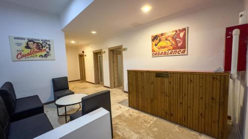 a waiting room with a wooden cabinet and a sign on the wall at Casablanca Garden Hotel in Nevsehir