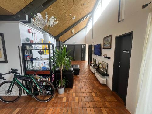 a room with a bike parked in a room at Godaland Guesthouse in Hlíðarendi