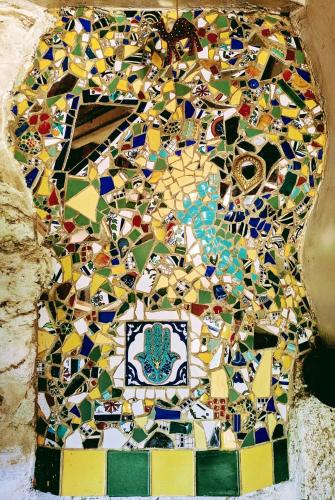 a mosaic floor with a variety of colored tiles at Le Mas Franc in Enveitg