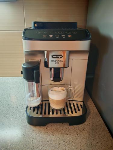 a coffee maker with a cup of coffee at Snoopy House in Žužemberk