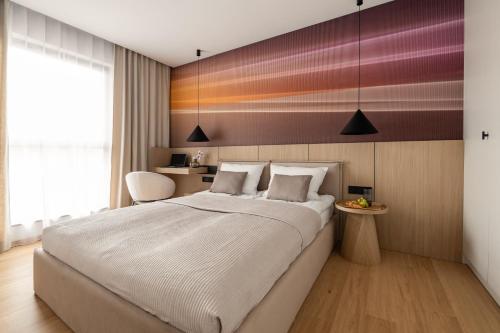 Postel nebo postele na pokoji v ubytování Sunset View - MAZURIA APARTAMENTY