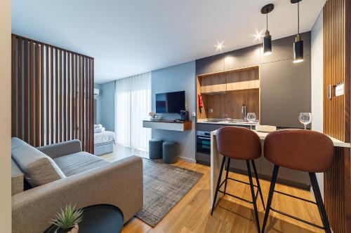 a living room with a couch and a table at Seagull Lodge incl Parking by Home Sweet Home Aveiro in Aveiro