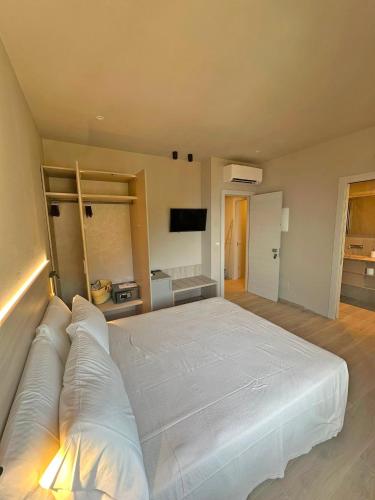 a bedroom with a large white bed in a room at Cloud Nine in Riomaggiore