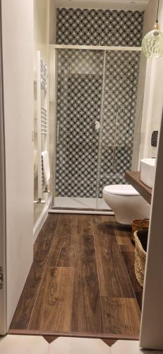 a bathroom with a shower and a toilet and a sink at Casa Graziella in Capo dʼOrlando