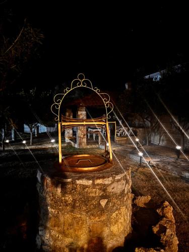 a bench sitting on top of a rock at night at Villa Gaia Navarino in Korifásion