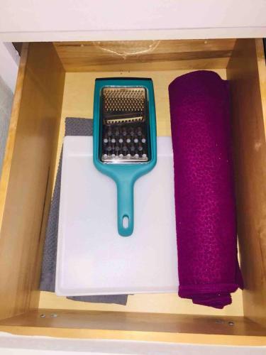 a toy keyboard and a comb in a drawer at Witte Wonderland - Separate Garage Apartment!! in Kyle