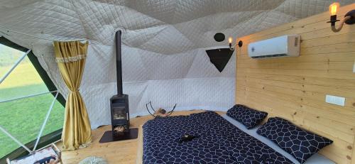 a room with a cat sitting inside of a tent at GLAMPING Považie in Trenčín