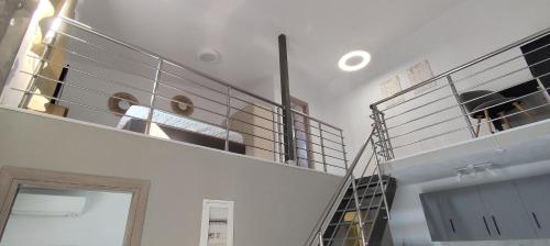 a spiral staircase in a room with a stair case at Modern House Close to the Sea Asprovalta in Asprovalta