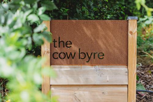 a sign that says the coweye written on it at The Cow Byre in Dursley