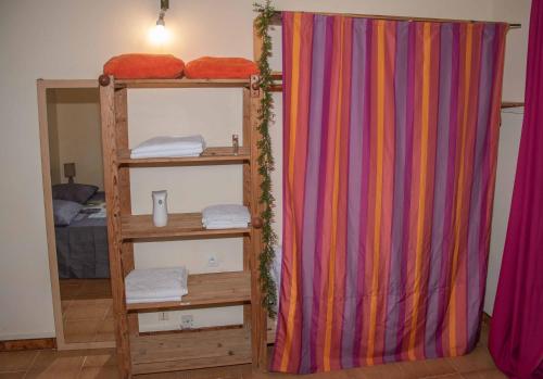a room with two bunk beds and a curtain at Haut de Villa in Fort-de-France