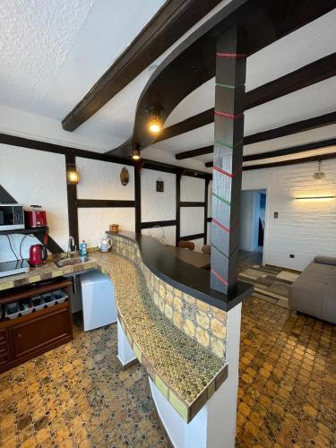 a kitchen with a counter top in a room at Am Waldrand in Attendorn