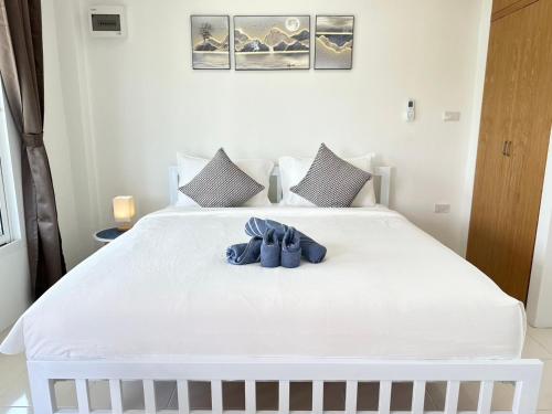 Katil atau katil-katil dalam bilik di Sachi House Stay Near Muay Thai Gym and Beach
