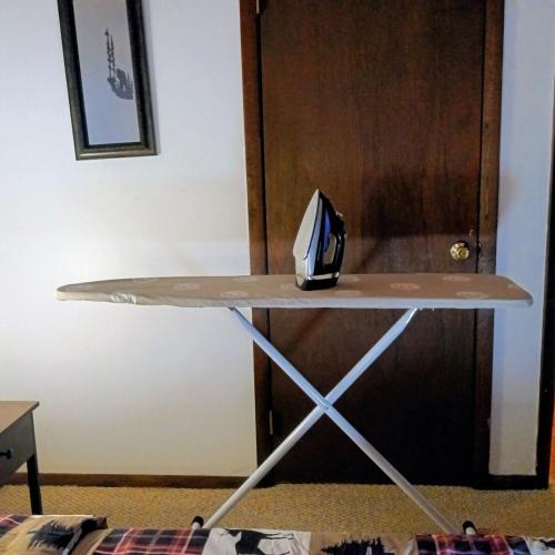 a table with a helmet sitting on top of it at Hideout Pocono Chalet in Lake Ariel