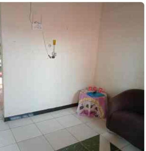 a corner of a room with a couch and a wall at Energia positiva cop 30 in Benevides