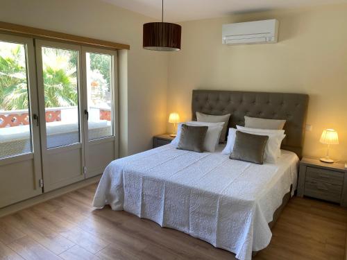 Ένα ή περισσότερα κρεβάτια σε δωμάτιο στο Bugan Villa