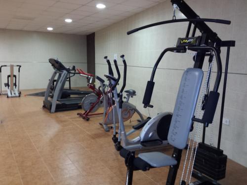 a gym with several exercise bikes in a room at Camping l'Alqueria in Gandía