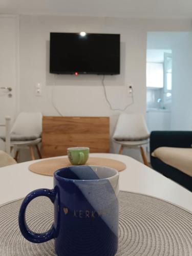 a blue coffee cup sitting on a table at LA CASA Di GIORGIO in Pentati