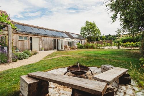 a fire pit in the backyard of a house at The Cow Byre in Dursley