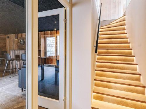 a staircase in a house with a view of a dining room at 5 star holiday home in Højslev in Højslev