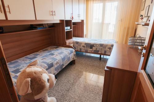 a room with two beds and a stuffed animal at Al Civico Centocinquantasei in Latiano