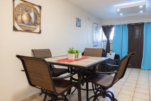 a dining room with a table and chairs at Beach Apartment C3 Montones in Jobos