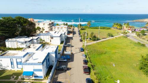 an aerial view of a street with houses and the ocean at Beach Apartment C3 Montones in Jobos