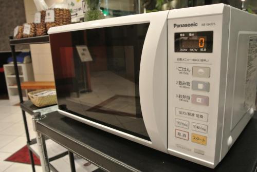 a microwave oven sitting on a table in a store at Hotel Kakegawa Hills in Kakegawa