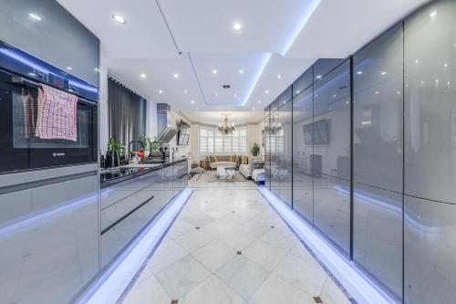 an office lobby with glass walls and a living room at Chingford Manor in Chingford