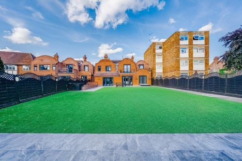 a large artificial lawn in front of a building at Chingford Manor in Chingford