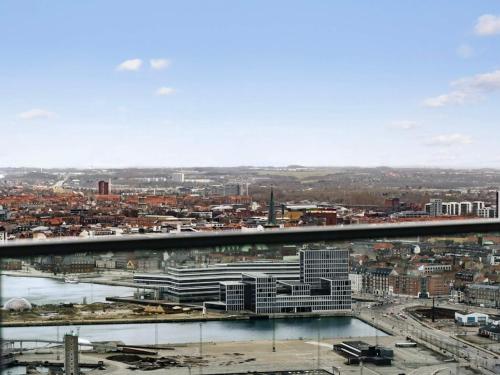 a view of a city with a bridge and buildings at 5 star holiday home in Aarhus C in Aarhus