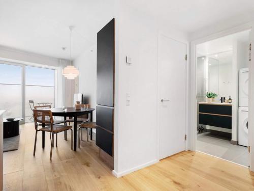 a kitchen and dining room with a table and chairs at 5 star holiday home in Aarhus C in Aarhus