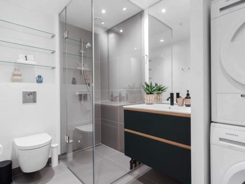 a bathroom with a shower and a toilet and a sink at 5 star holiday home in Aarhus C in Aarhus